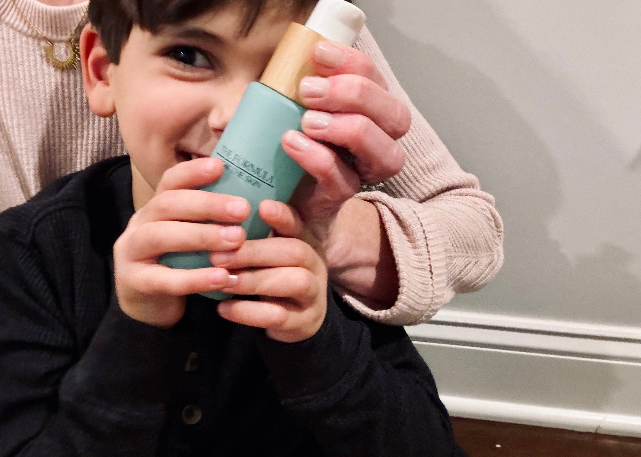 child holding skin healing cream